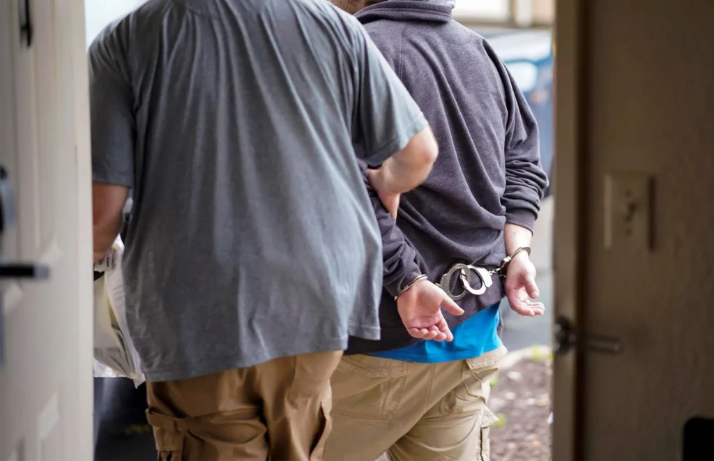 predator in hand cuffs